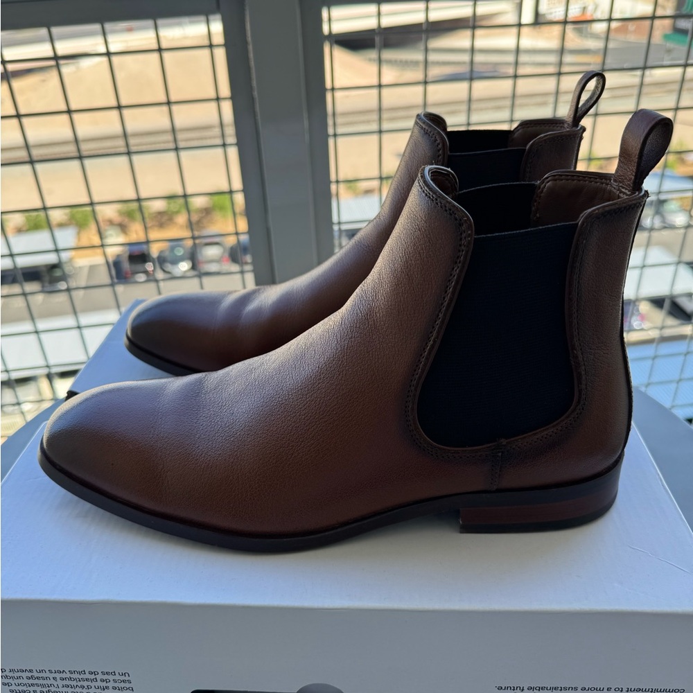 I am selling these Cognac Chelsea boots men's size 8 from Aldo. Slightly worn